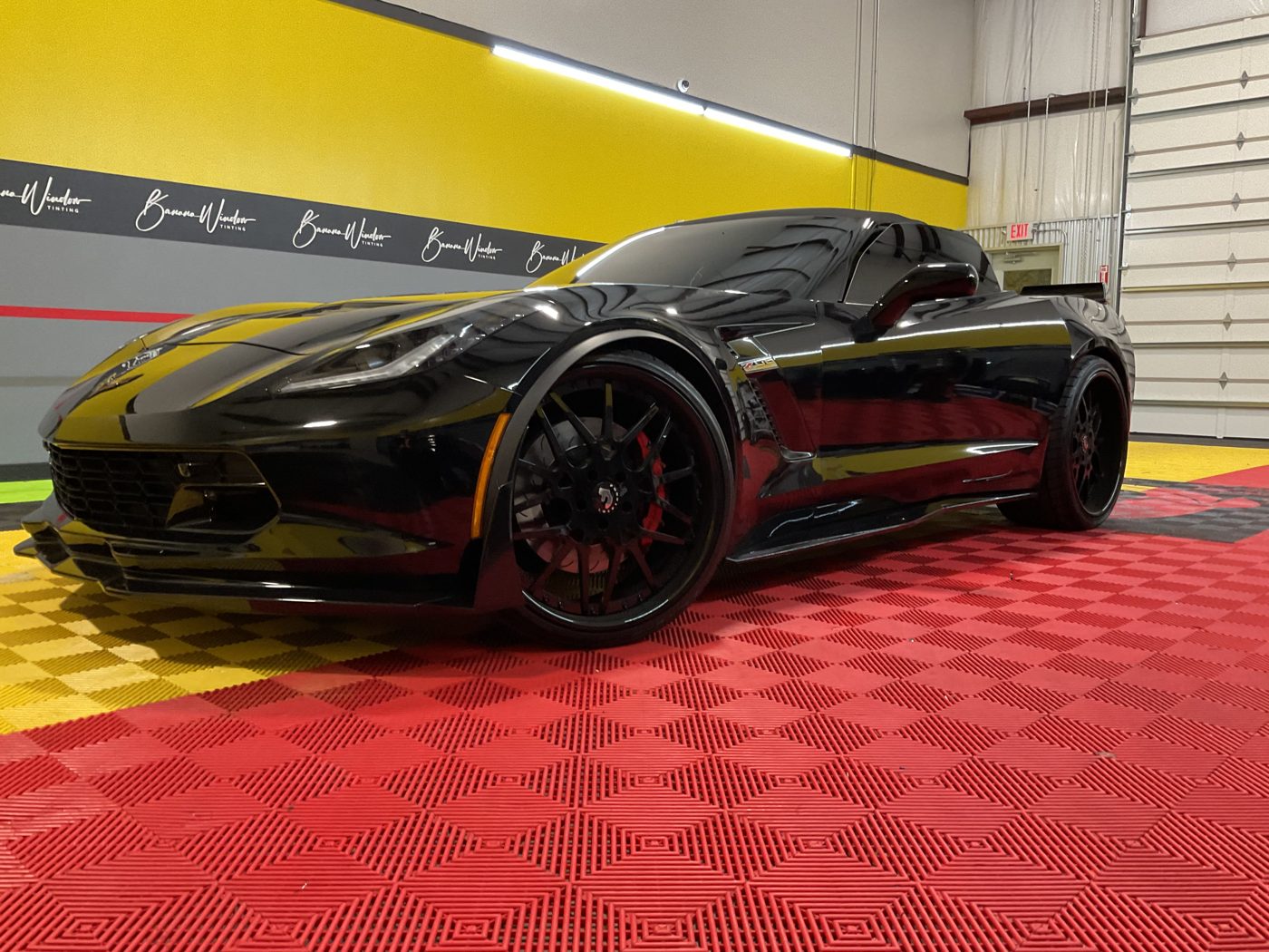 Black sports car in the Banana Window Tinting shop